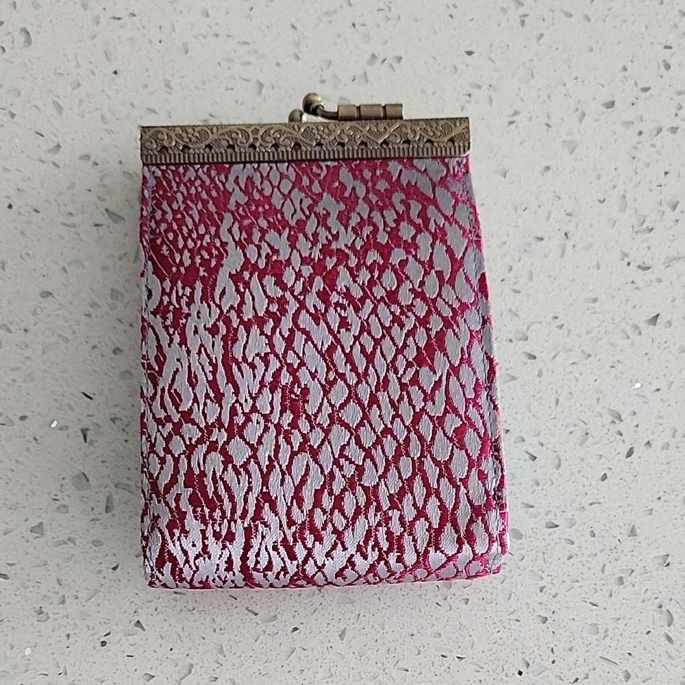 Sophisticated Pink and Silver Wristlet with Intricate Design